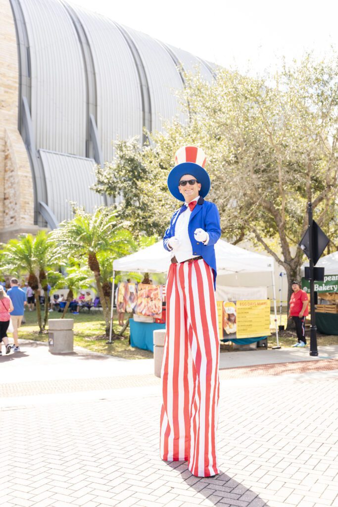 Stilt walker in Ave Maria