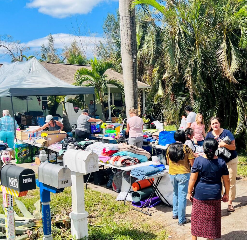 Ave Maria Hurricane Ian Relief Efforts, giving donated items to people