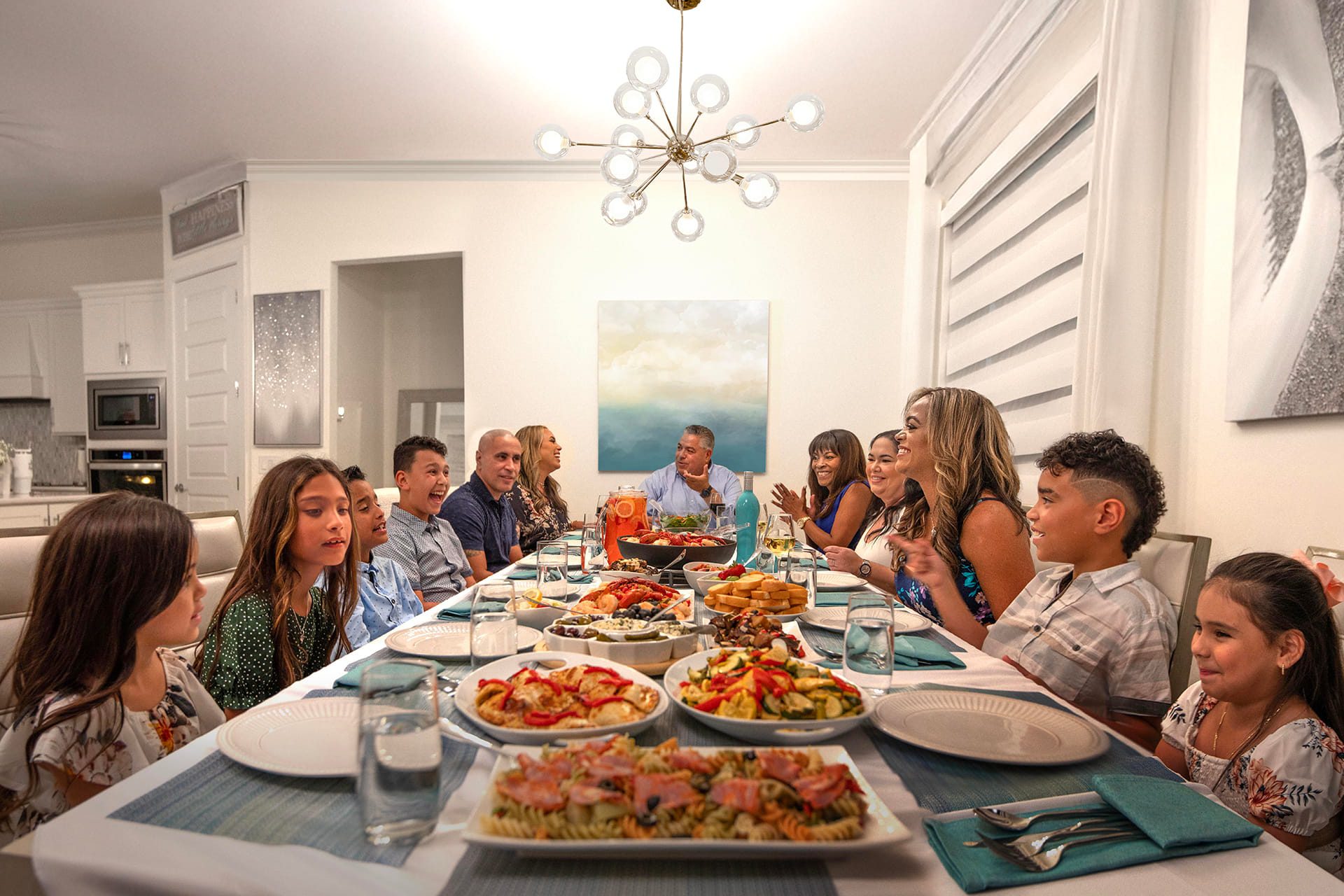 Large family gathers around table for dinner