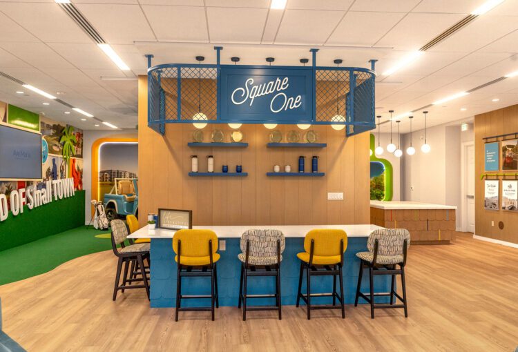 Seating area, information wall and coffee bar in Ave Maria Welcome Center
