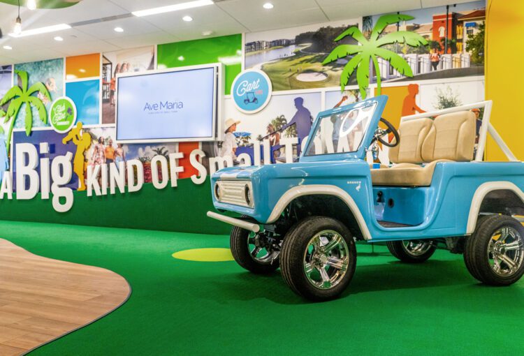 Vintage golf cart staged in Ave Maria Welcome Center