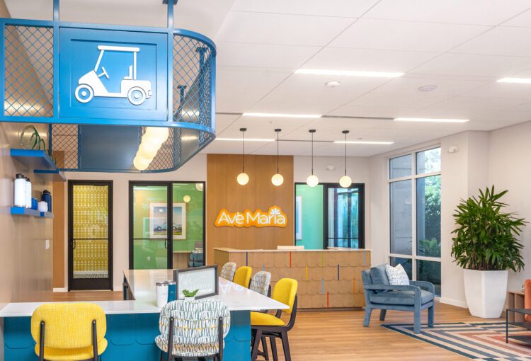 Coffee Bar and seating area in Ave Maria Welcome Center with reception desk