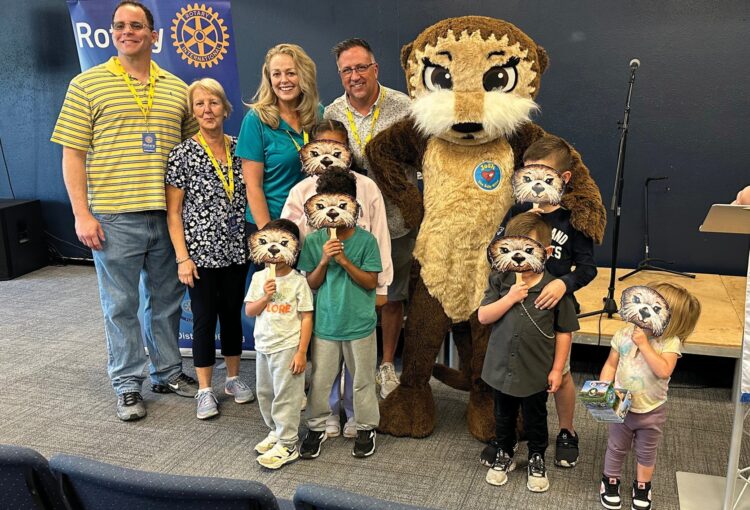 Incoming Rotary Club of Ave Maria President Jason Kurek, Rotarian Mary Harp-Jirschele, Kristina Ribali, Rotary Club of Ave Maria President JD Ribali and Josh the Otter with a class.