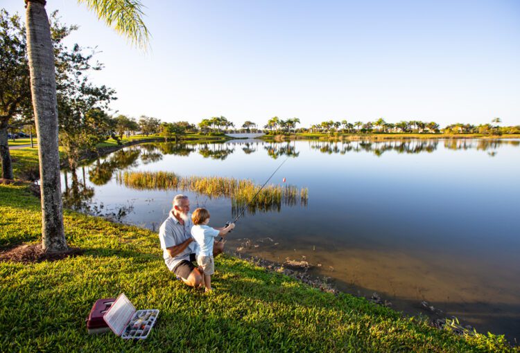 Grandfather and grandson fish from Rosary Lake in Ave Maria