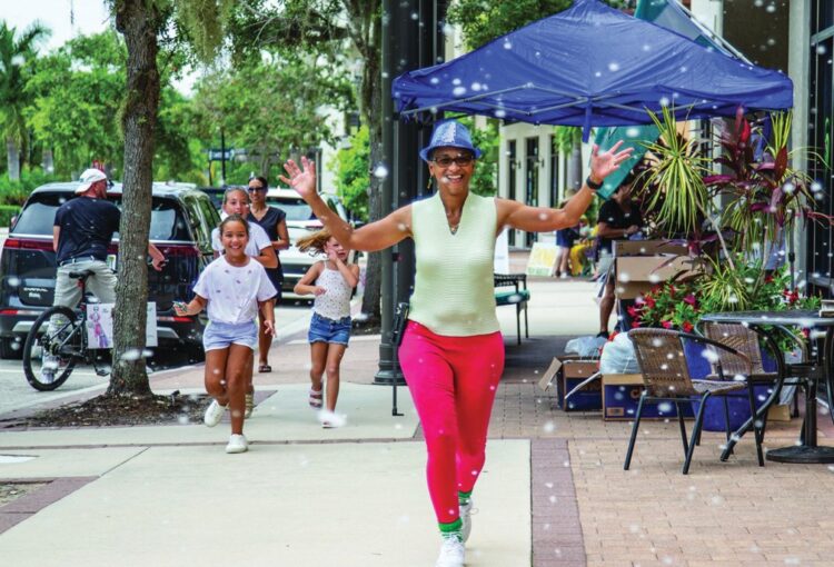 It’s snowing in Ave Maria at Christmas in July.