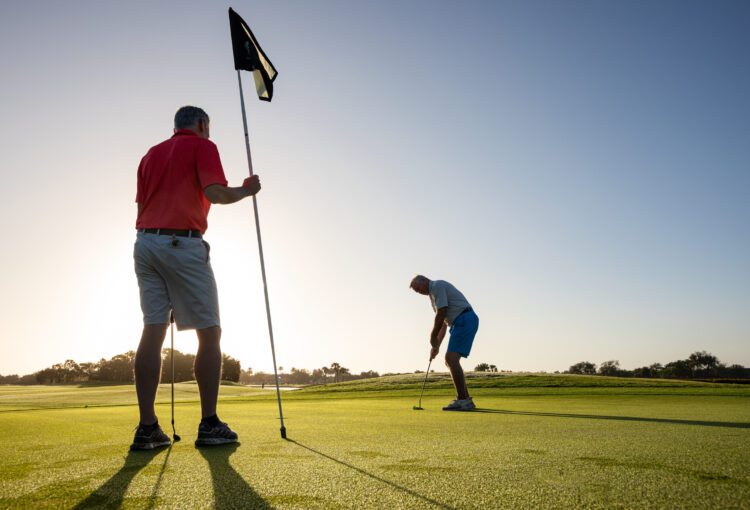 Men golf at Panther Run Golf Club