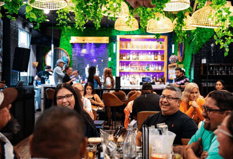 Patrons dining at Oasis The Kitchen Lounge in Ave Maria