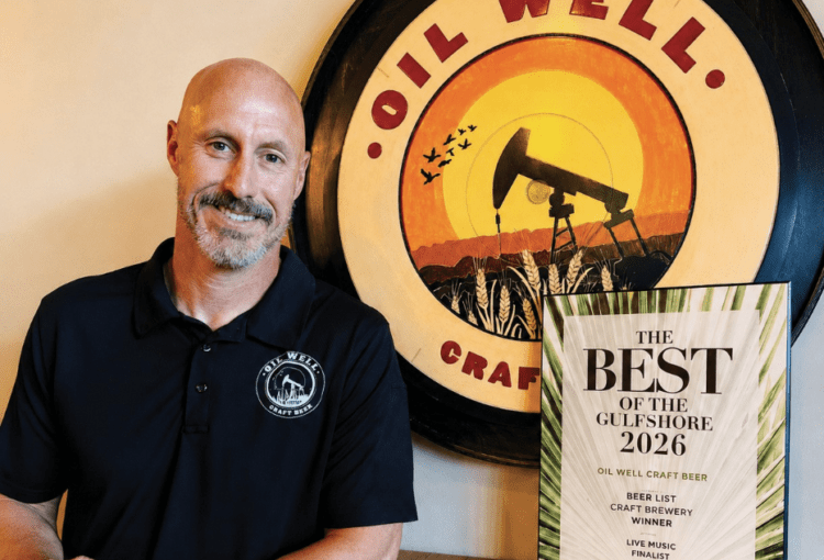 Matt Williams in front of the OWCB sign.